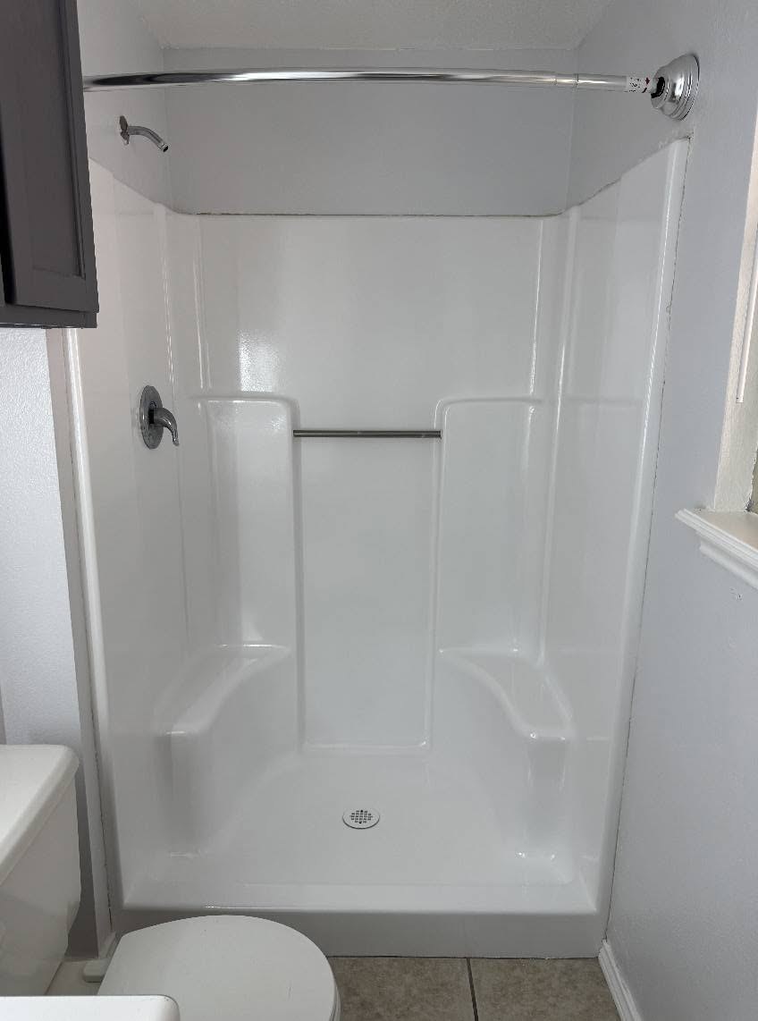 Resurfaced shower and tub combination